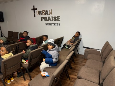 Children gathered at Urban Praise for a SWAG youth mentoring event